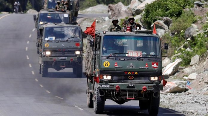 Indian Army convoy moves along a highway leading to Ladakh, at Gagangeer