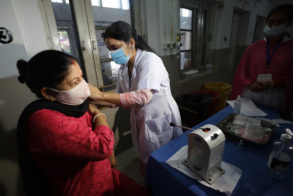 A woman receiving COVID vaccine jab at government hospital, Jammu-The Dispatch