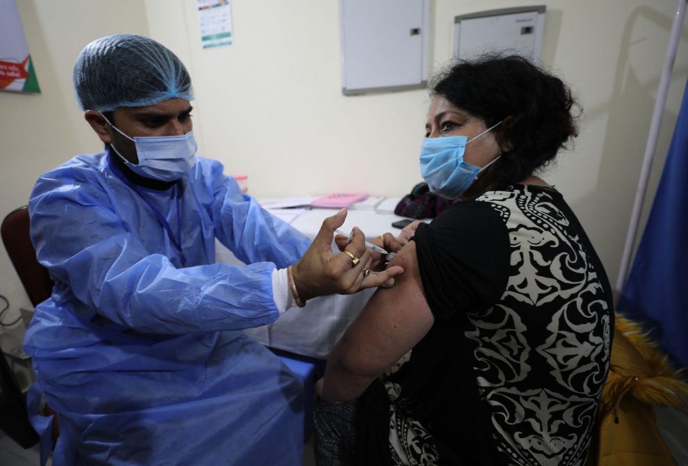 A-health-worker administering COVID-19-vaccine at Government hospital Shri-Maharaja-Gulab-Singh at Jammu