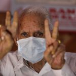 96-year-old Badrinath flashing victory sign after undergoing successful treatment for covid-19 at Vijaypur in Samba district -The Dispatch