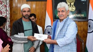 LG hands over land allotment orders to landless beneficiaries of PMAY-G