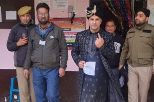 Groom in wedding attire turns up at polling station in Ganderbal